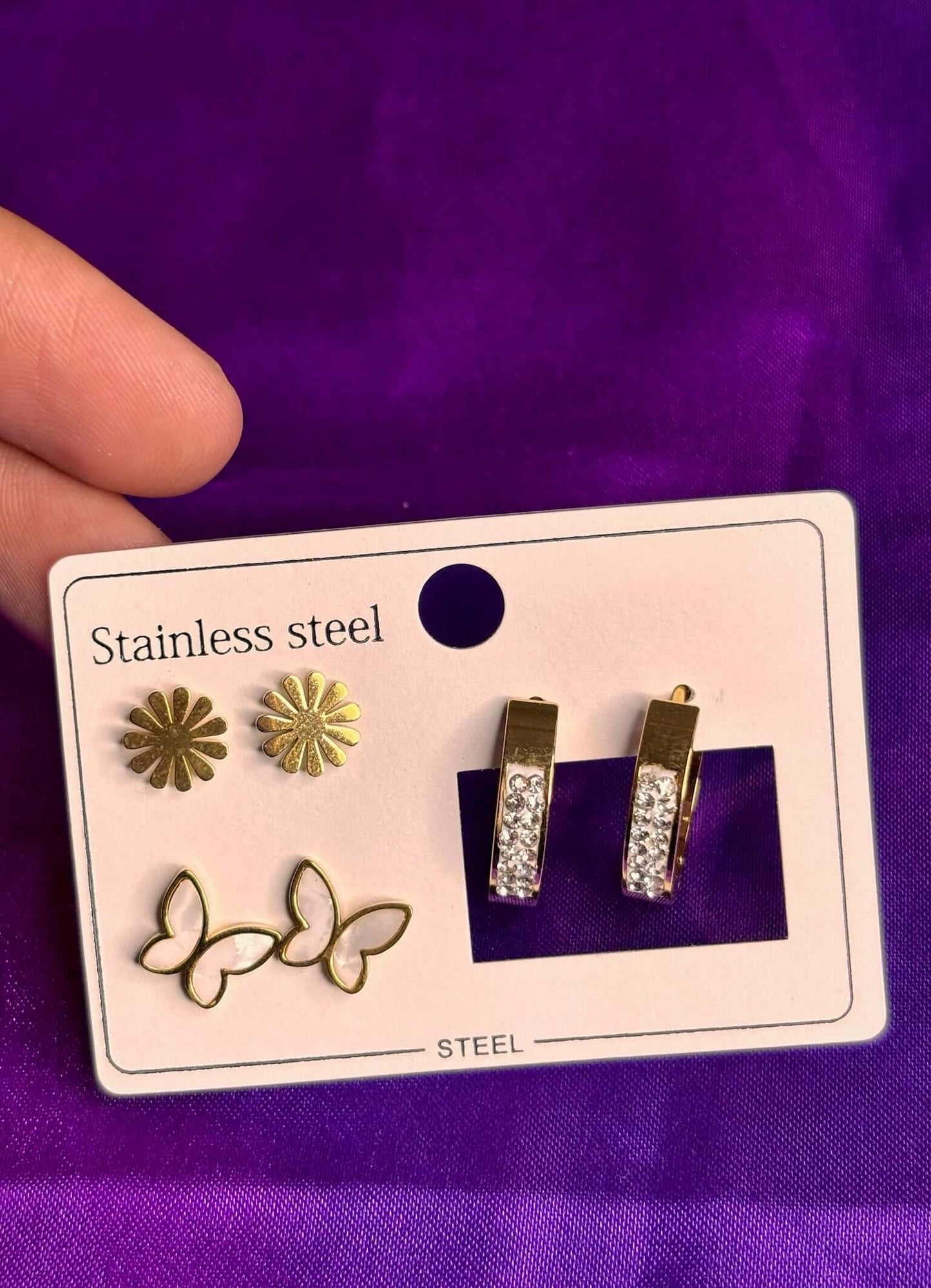 Gold stainless steel earring combo featuring daisy, butterfly, and crystal hoops, elegant imitation jewelry.