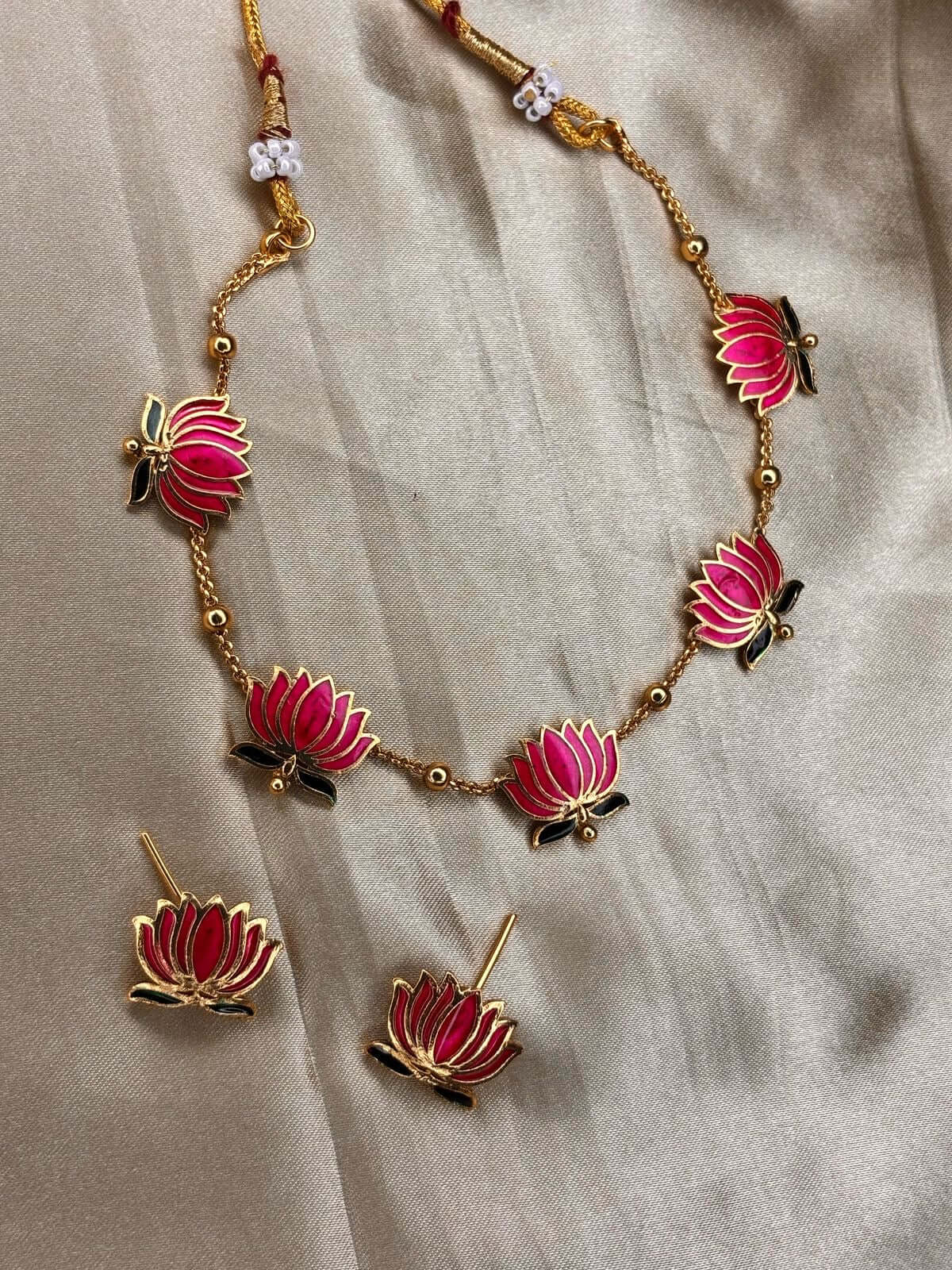 Pink Lotus Enamel Jewelry Set featuring delicate floral motifs and pastel pink finish