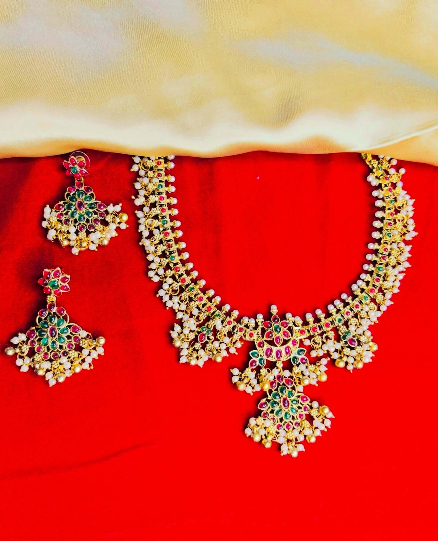 Antique temple design jewelry set with kundan work and elegant pearls