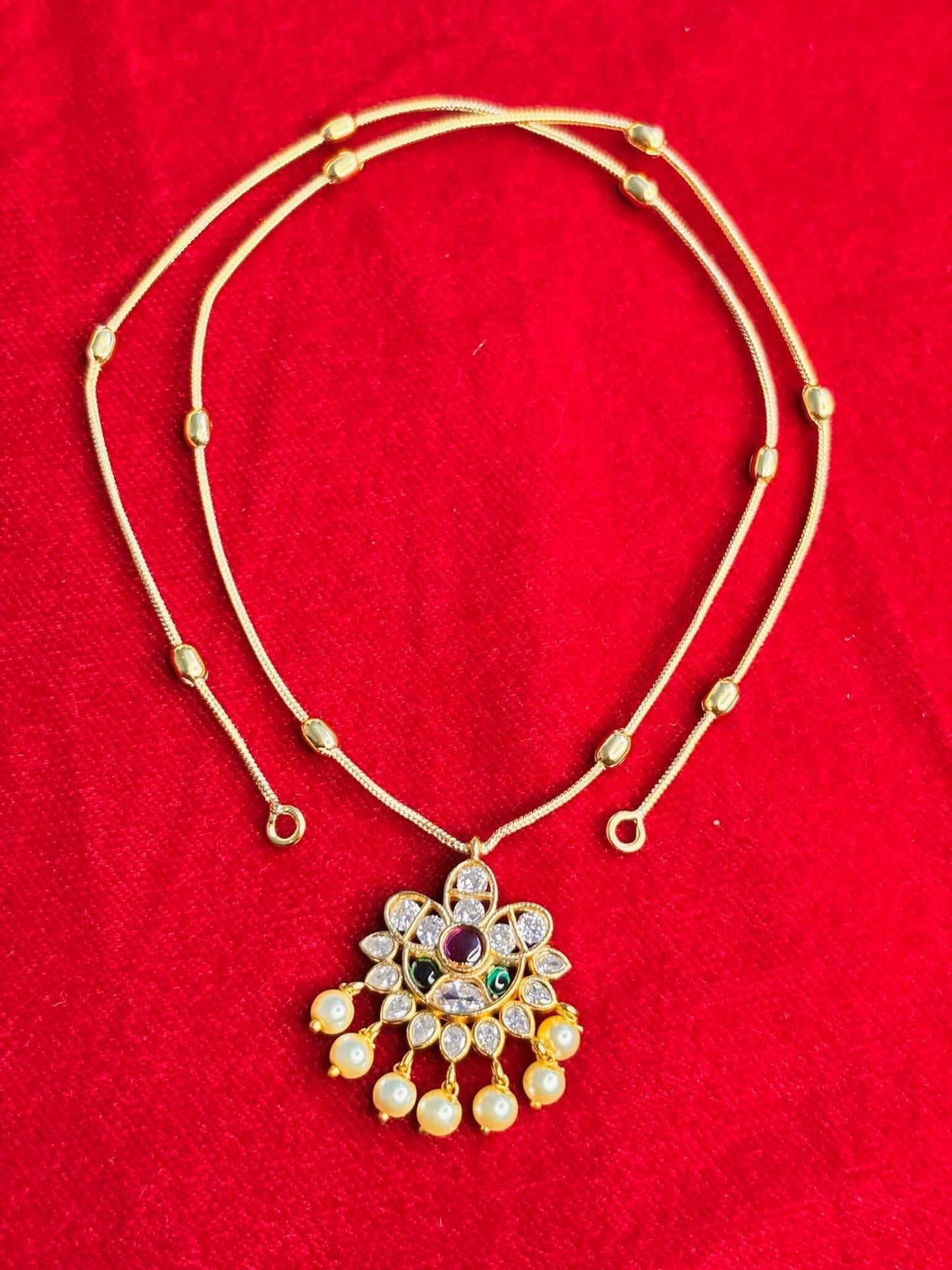 Simple floral pendant necklace set with delicate pearl drop accents