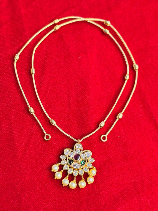 Simple floral pendant necklace set with delicate pearl drop accents