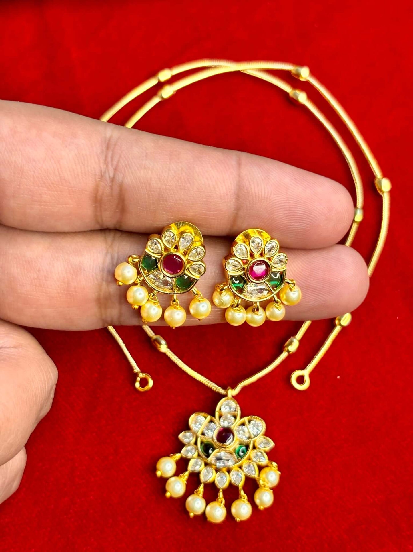 Elegant flower design pendant necklace with matching earrings and pearl drops
