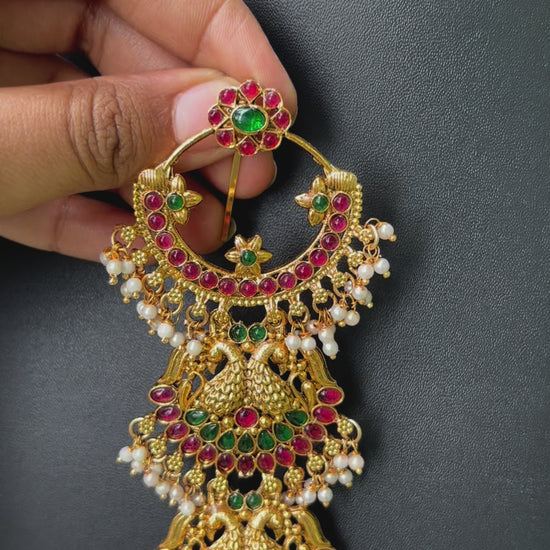 Close-up of handcrafted Jadai Billalu for wedding hairstyles in temple jewelry style